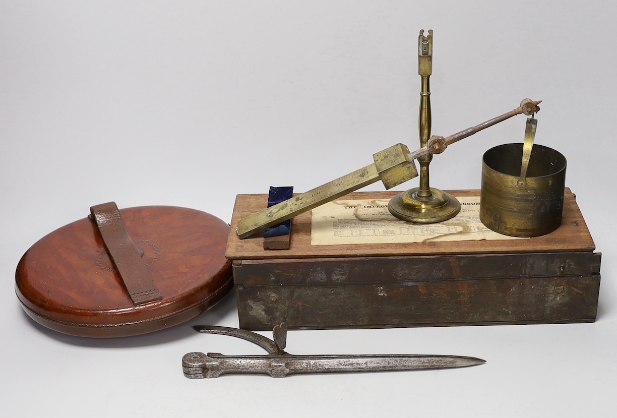 A late Georgian Marratt & Short Improved Chondrometer, a large surveyor's measure and a cast iron protractor